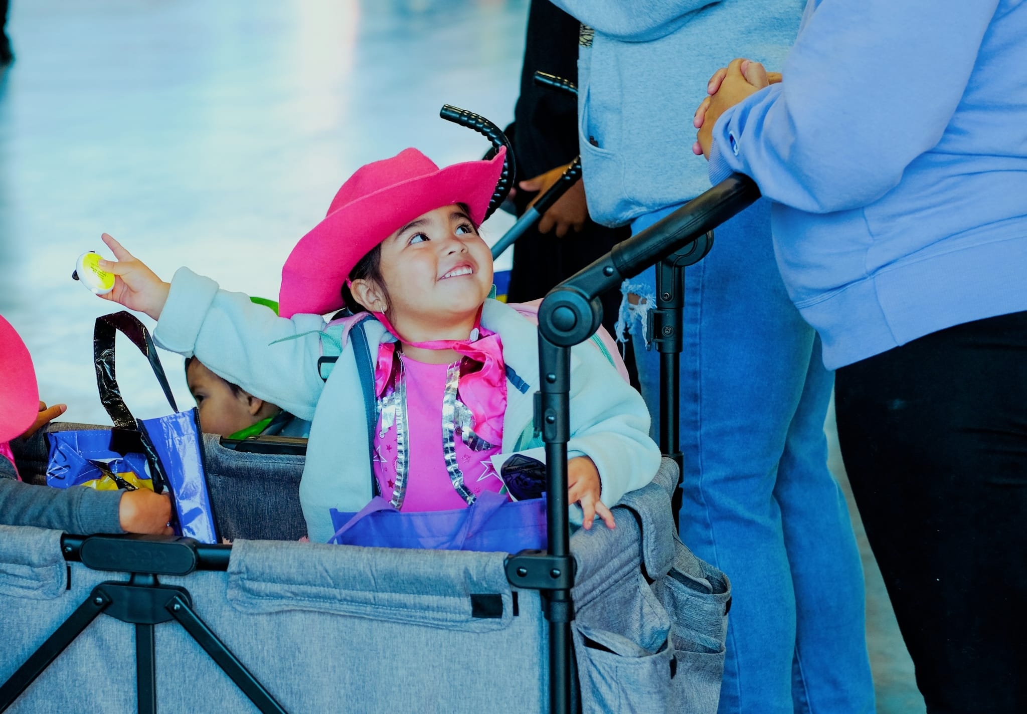 Smiling girl pointing 